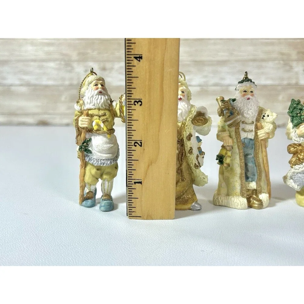 Lot of 4 Santa Figures Christmas Ornaments White Cream Gold Coats Decor